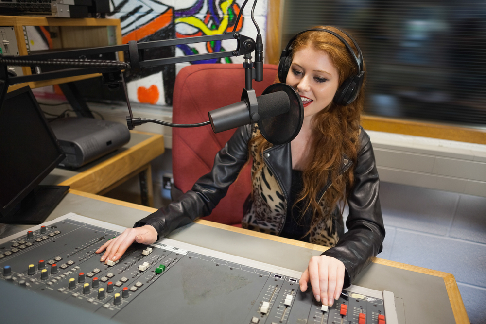 radio host moderating sitting in studio at college